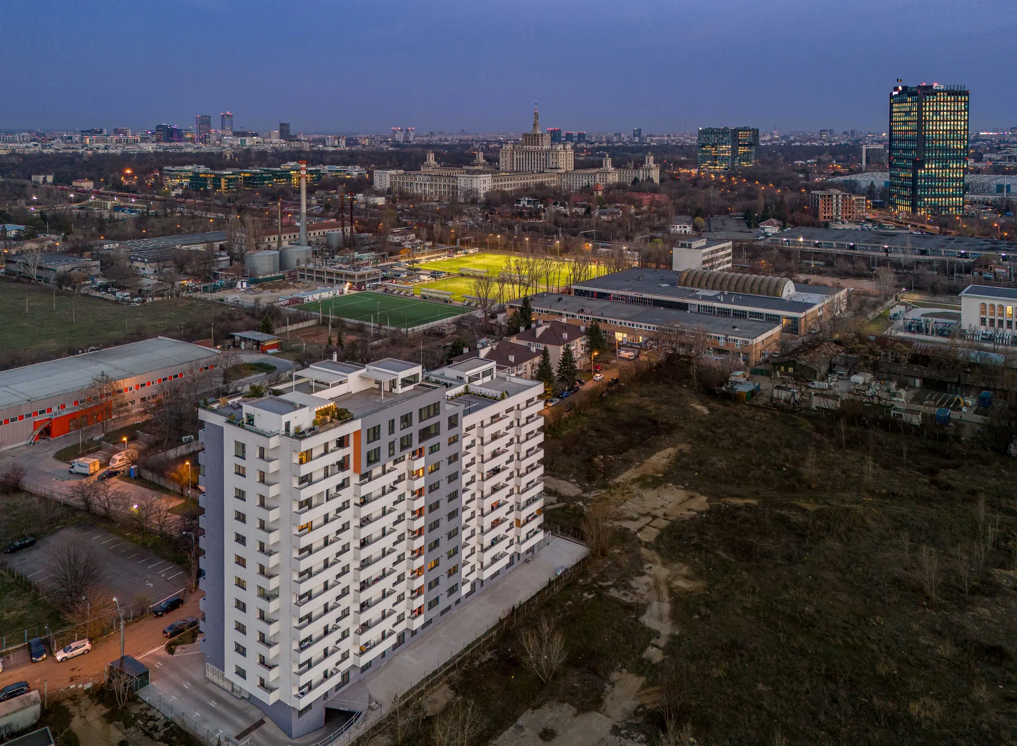New Residences Casa Presei at sunset, with Casa Presei Libere in the background