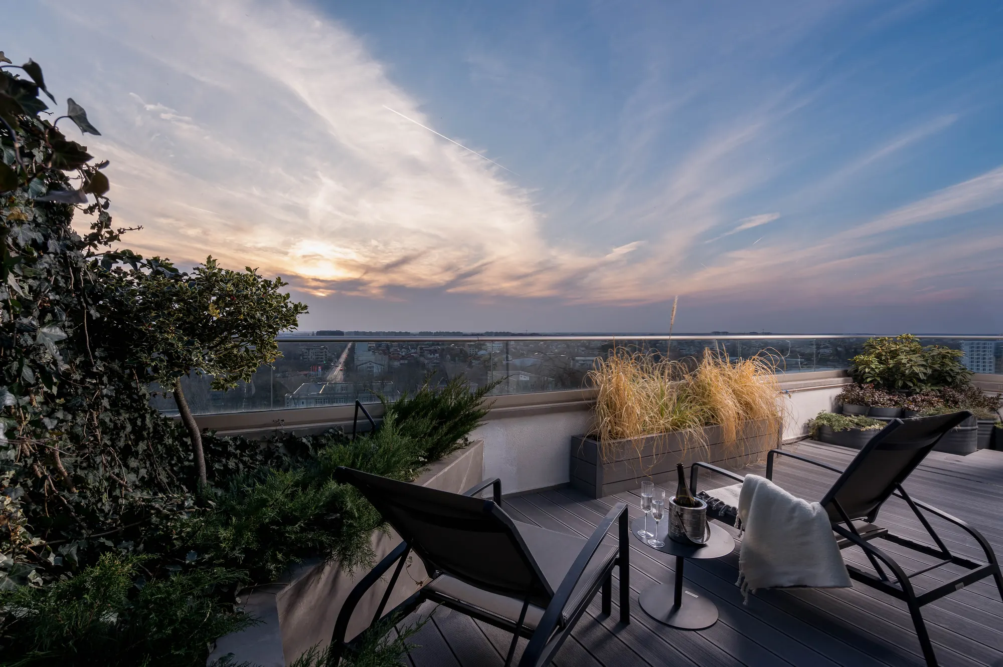 Furnished Casa Presei penthouse terrace at sunset
